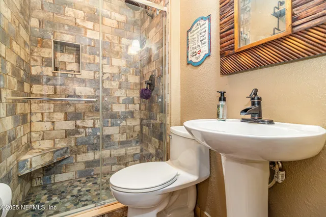 a bathroom with a sink and a toilet