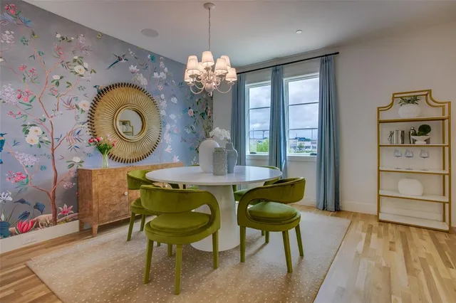 a dining room with furniture and a window