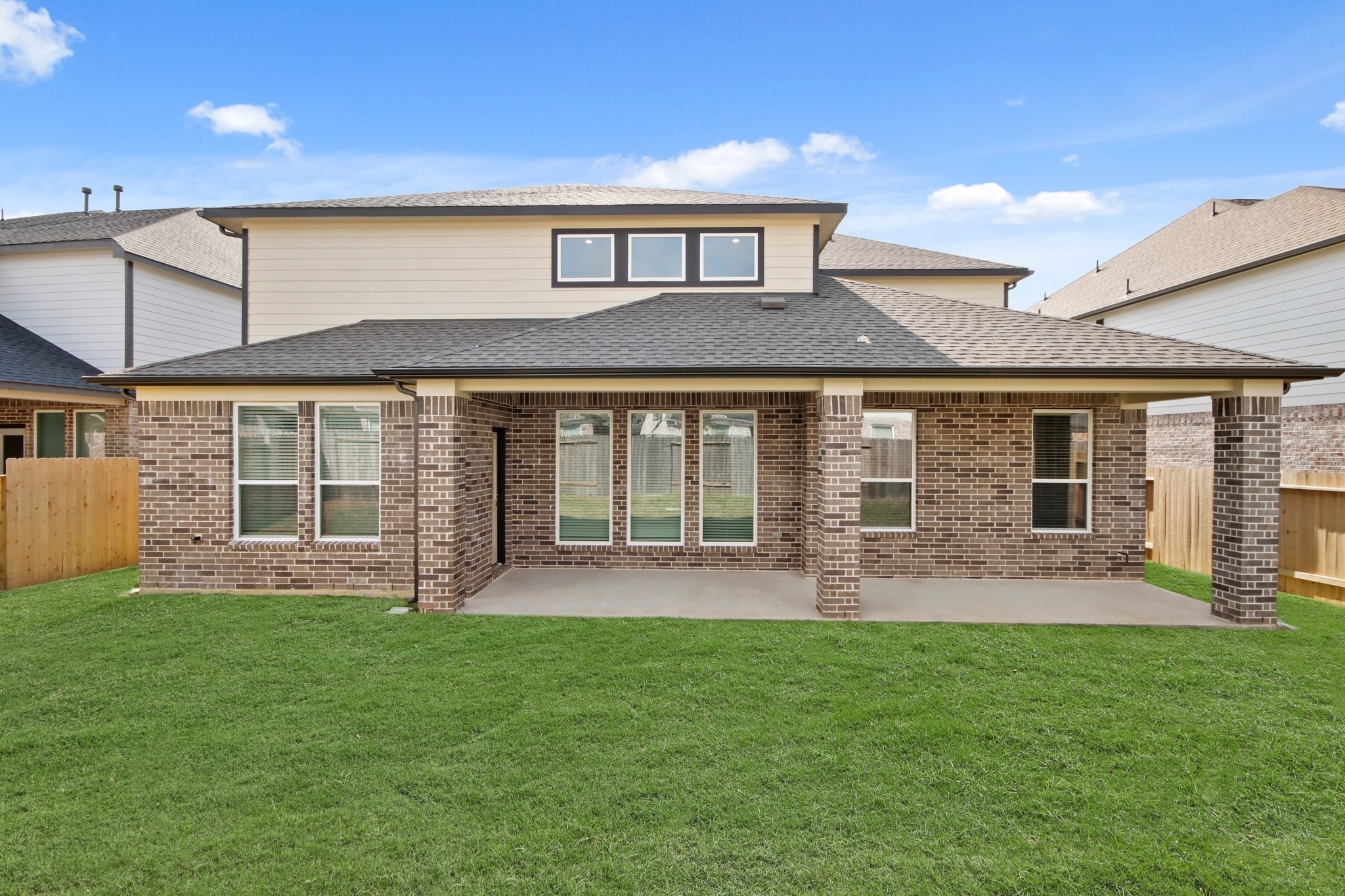 3211 Hawthorne Drive Conroe, TX 77301 - Photo 23 of 28 a front view of house with a garden and patio