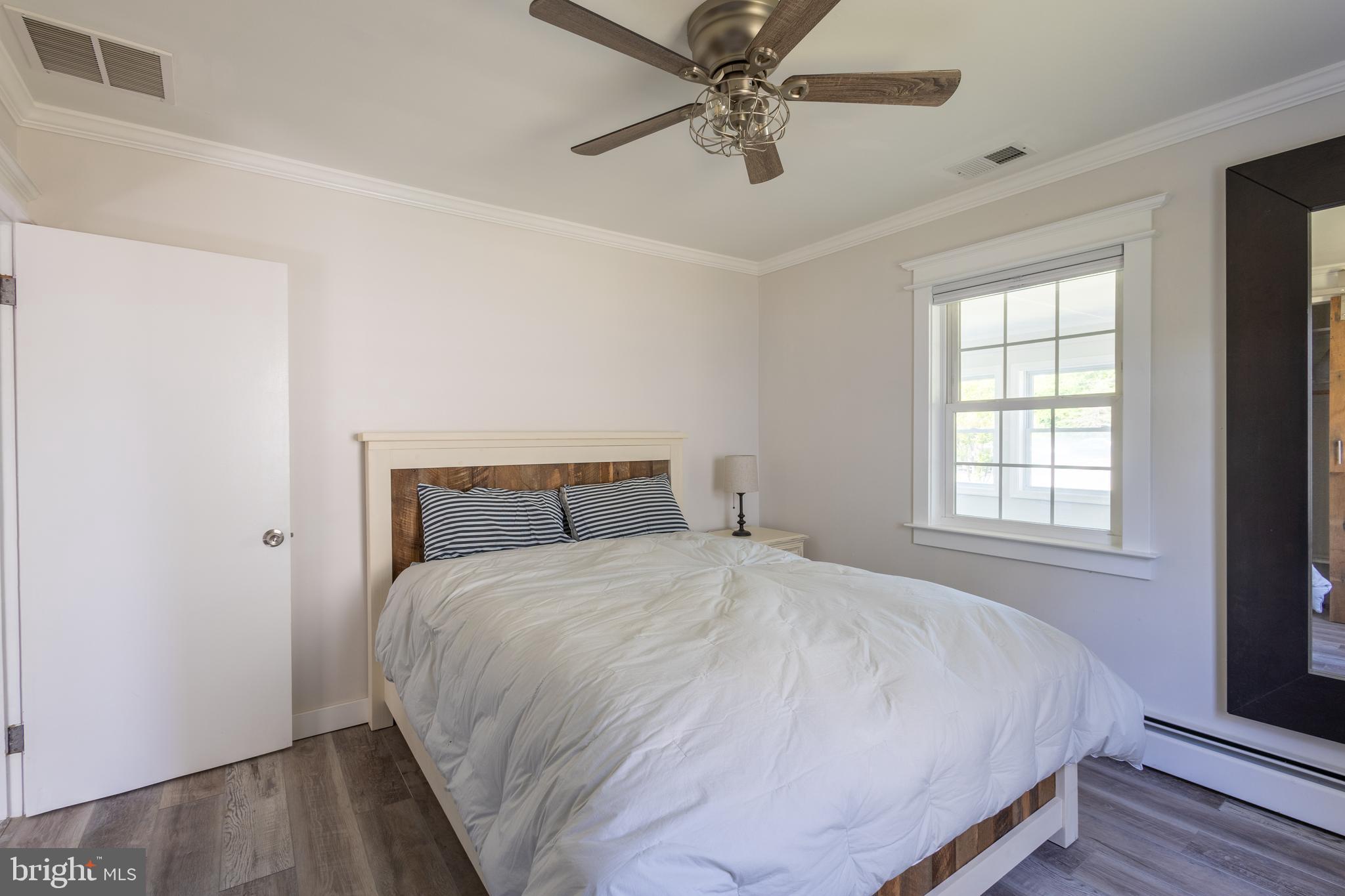 1303 Bay Ridge Avenue Annapolis, MD 21403 - Photo 15 of 29 Primary bedroom with king size bed