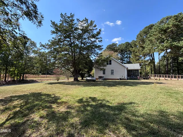 a view of outdoor space with trees all around