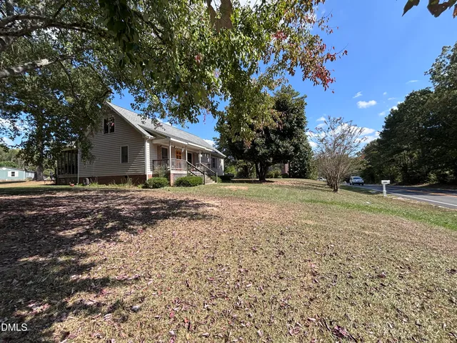 a backyard of a house with large trees