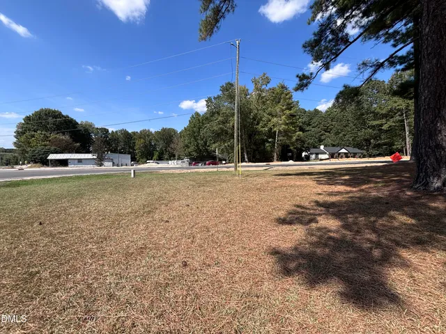 a view of outdoor space with playground and green space