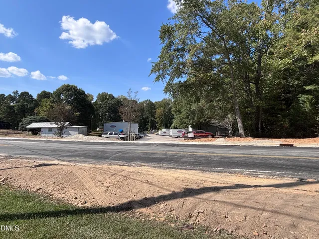 a view of a tree in front of a house