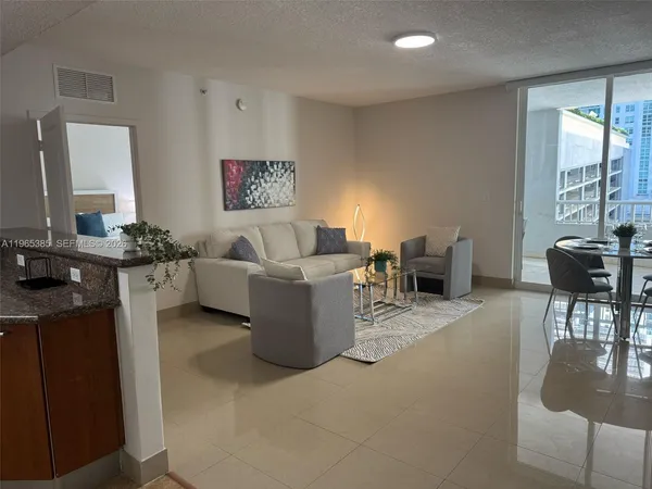 a view of livingroom with furniture and windows