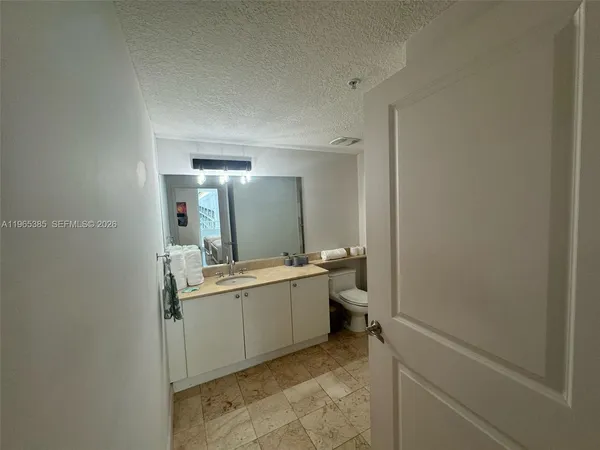 a room with a sink and a mirror