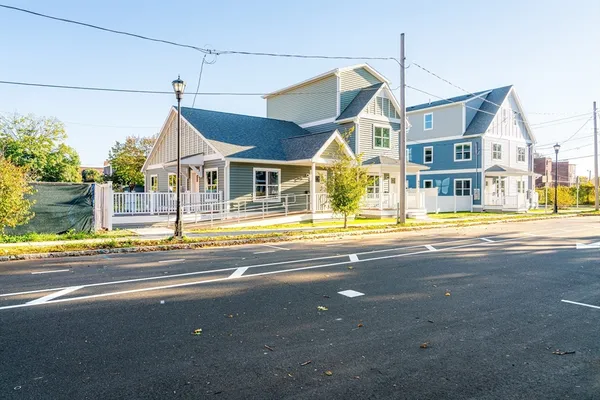 a view of a house and a big yard
