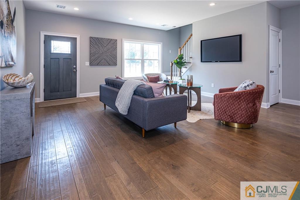 48 Brookville Road Edison, NJ 08817 - Photo 15 of 28 a living room with furniture and a flat screen tv
