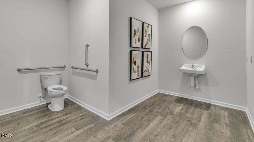 8 Tiger Eye Drive Clayton, NC 27520 - Photo 14 of 37 a bathroom with a toilet and a mirror