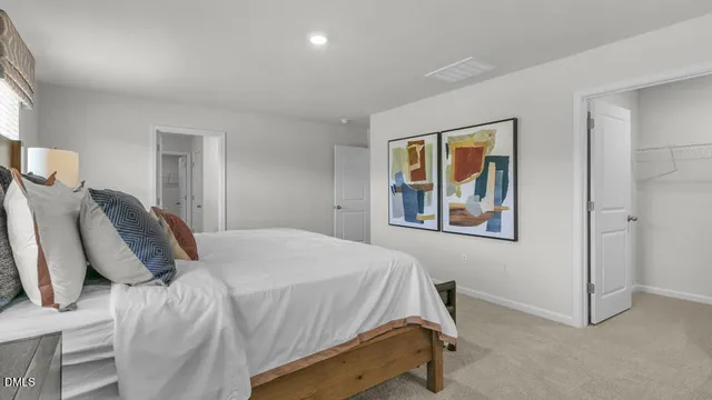 a bedroom with bed and window