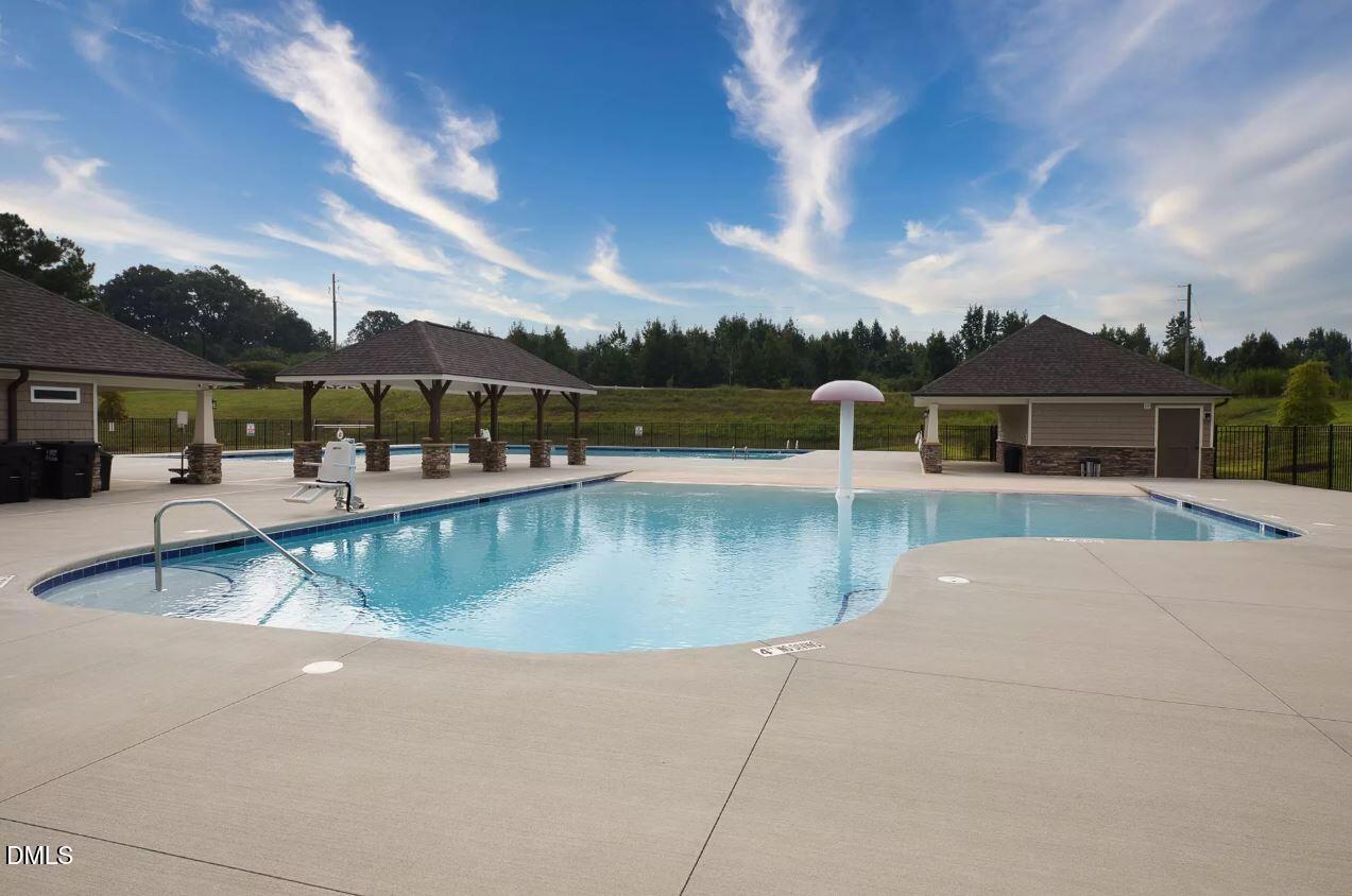 8 Tiger Eye Drive Clayton, NC 27520 - Photo 33 of 37 a view of a swimming pool with a patio