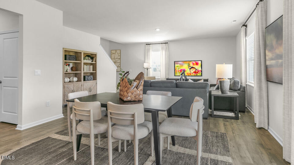 8 Tiger Eye Drive Clayton, NC 27520 - Photo 10 of 37 a view of a dining room with furniture and wooden floor