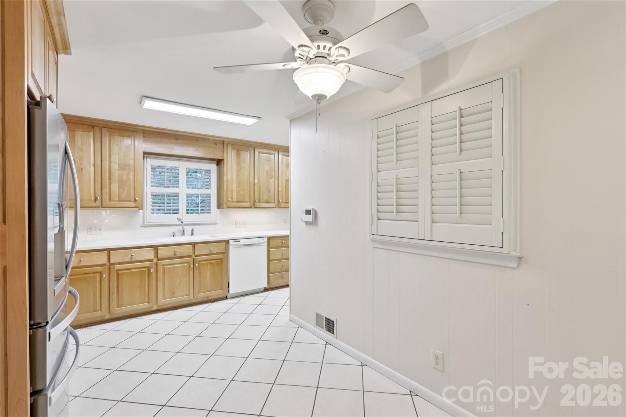 1002 Ridge Street Albemarle, NC 28001 - Photo 14 of 45 a large white kitchen with a stove a sink dishwasher and a refrigerator