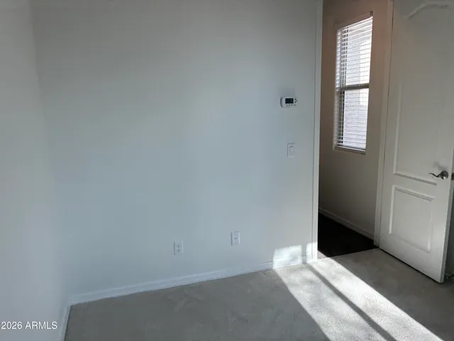 a white toilet sitting next to a white sink