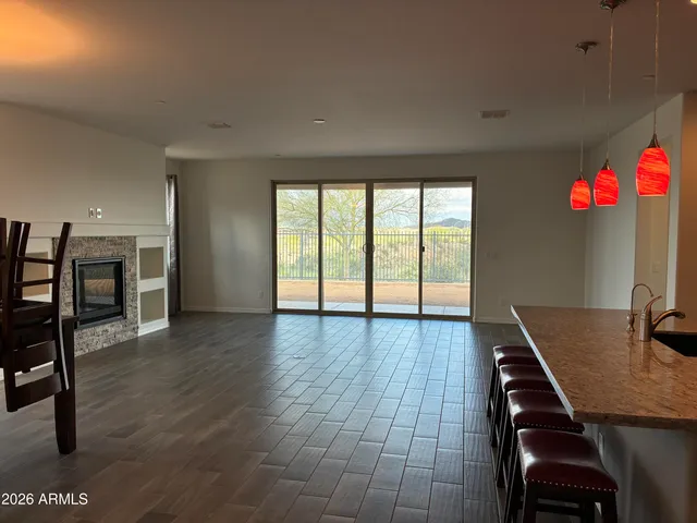 a workspace with furniture wooden floor and window