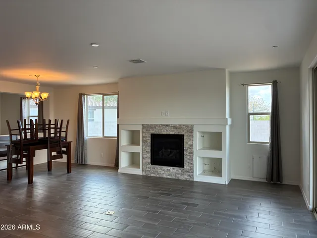a view of a livingroom with furniture and a fireplace
