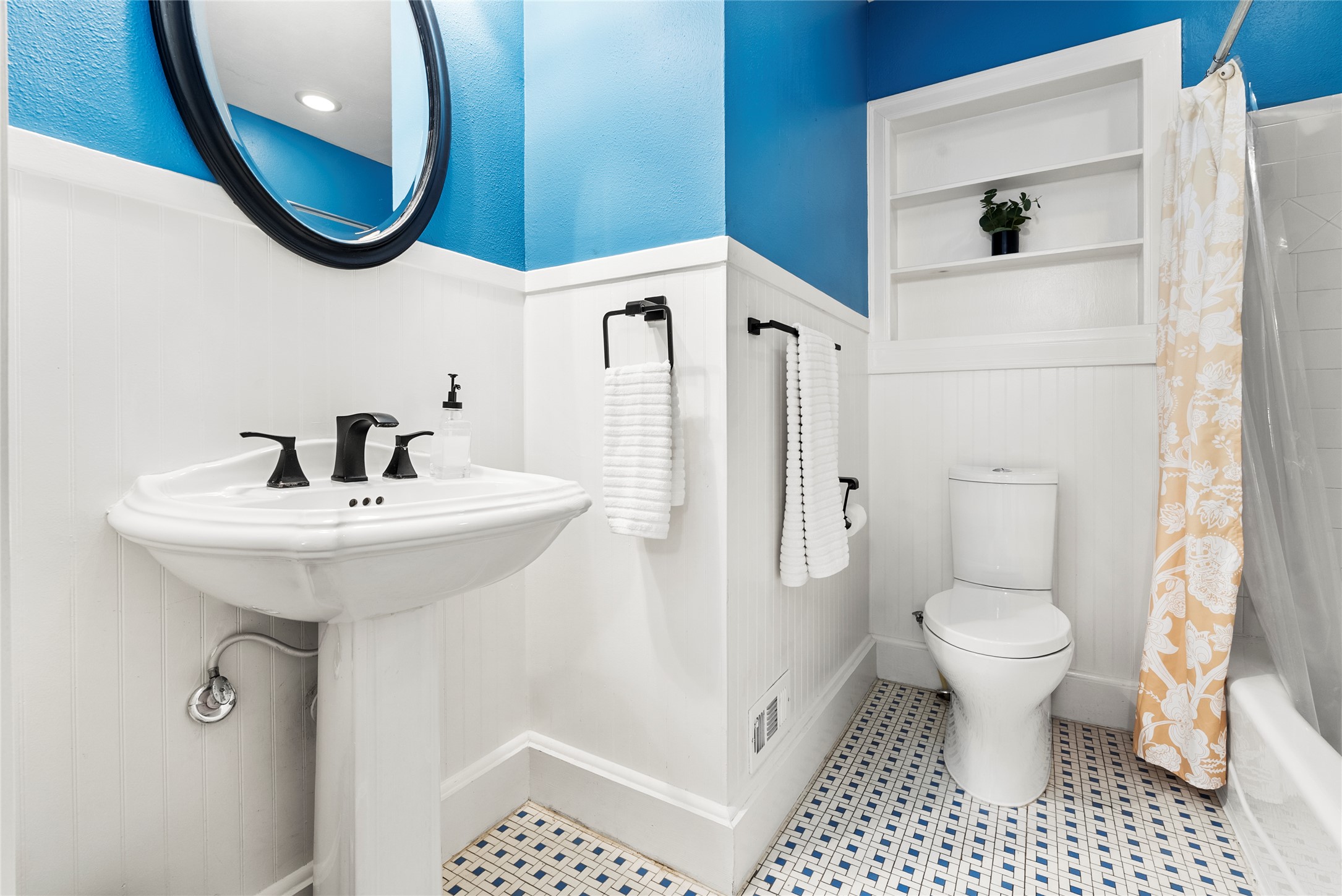 1507 Newning Avenue Austin, TX 78704 - Photo 14 of 37 Bathroom featuring a wainscoted wall and shower / bath combo