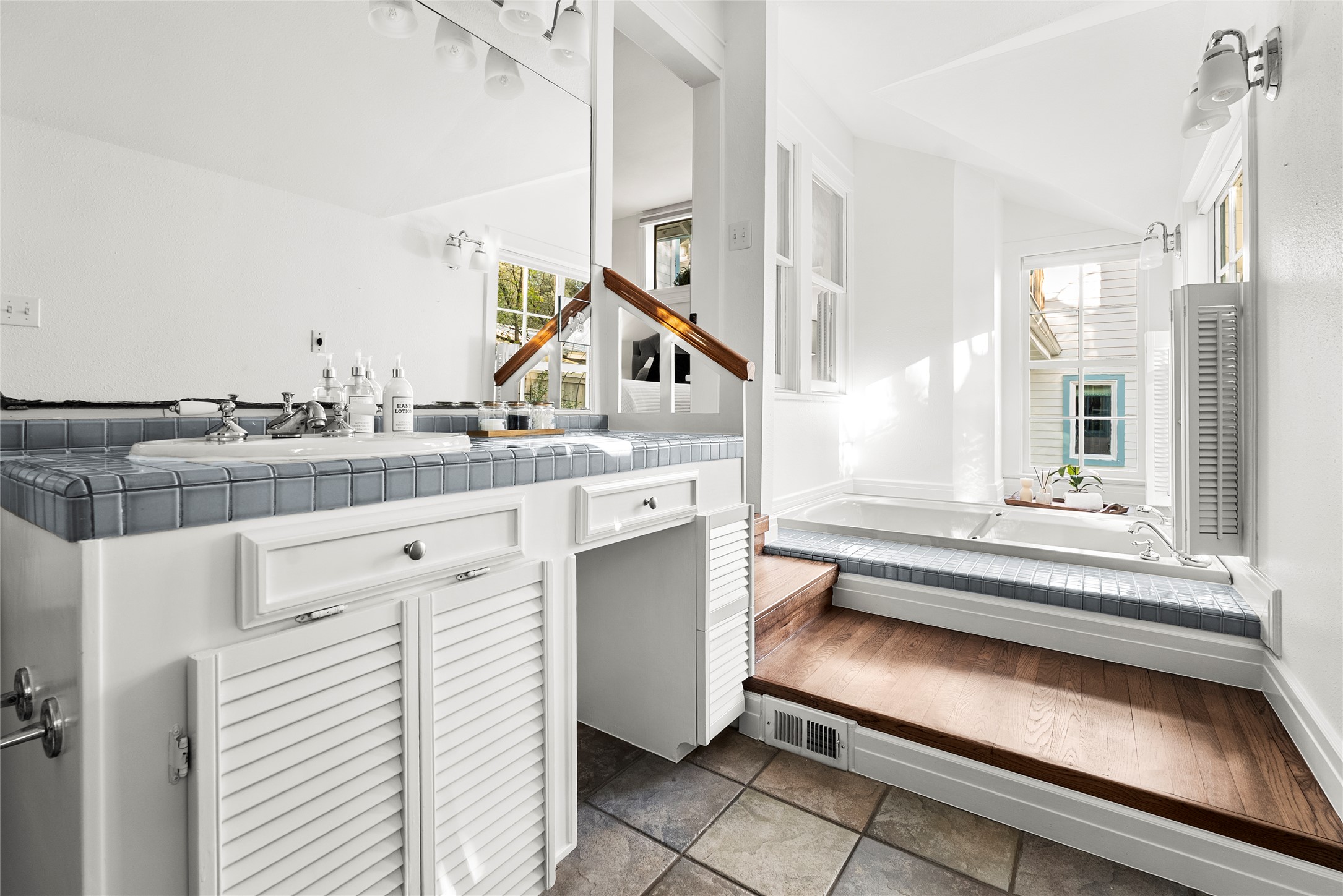 1507 Newning Avenue Austin, TX 78704 - Photo 16 of 37 Bathroom with a garden tub, vanity, and lots of natural light
