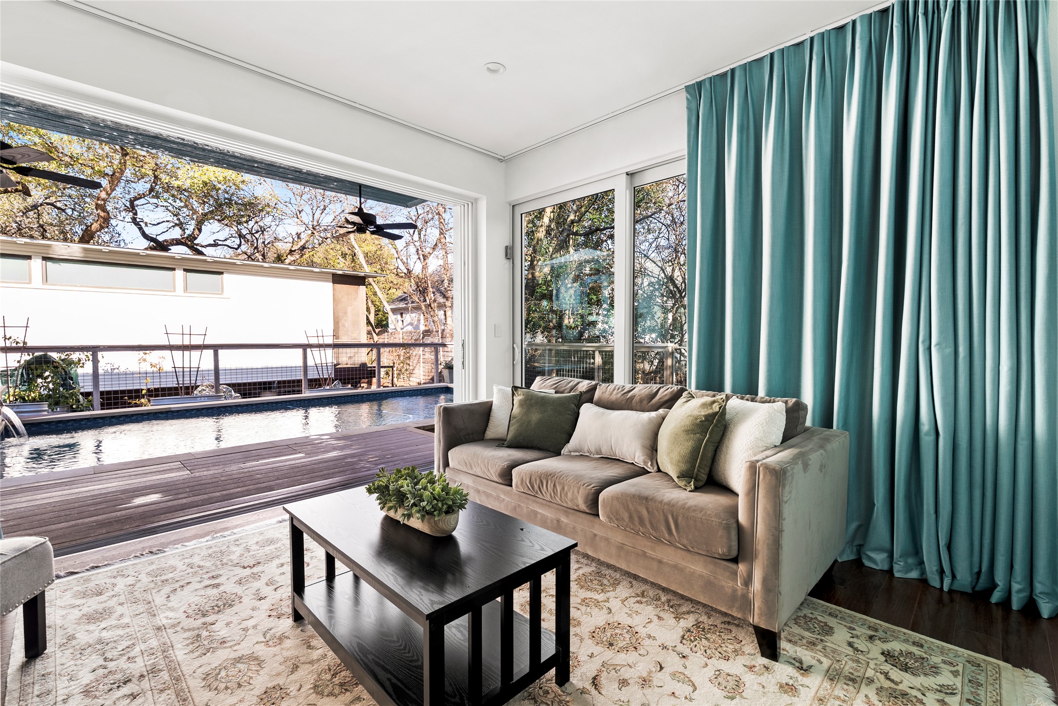 1507 Newning Avenue Austin, TX 78704 - Photo 19 of 37 family room with wood floors featuring sliding glass doors that disappear perfect for entertaining