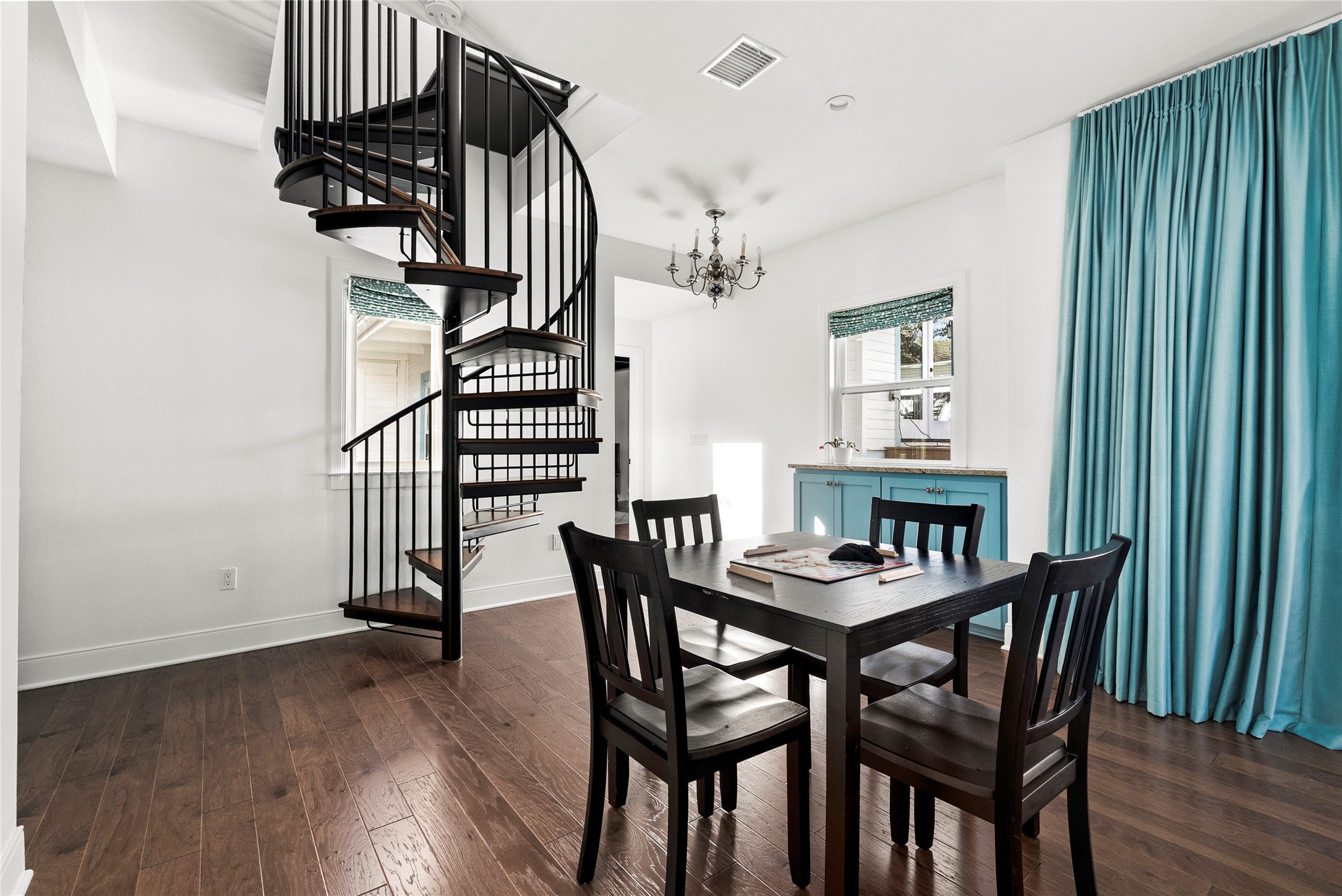 1507 Newning Avenue Austin, TX 78704 - Photo 22 of 37 Game table area in family room with stairway leading to primary bedroom