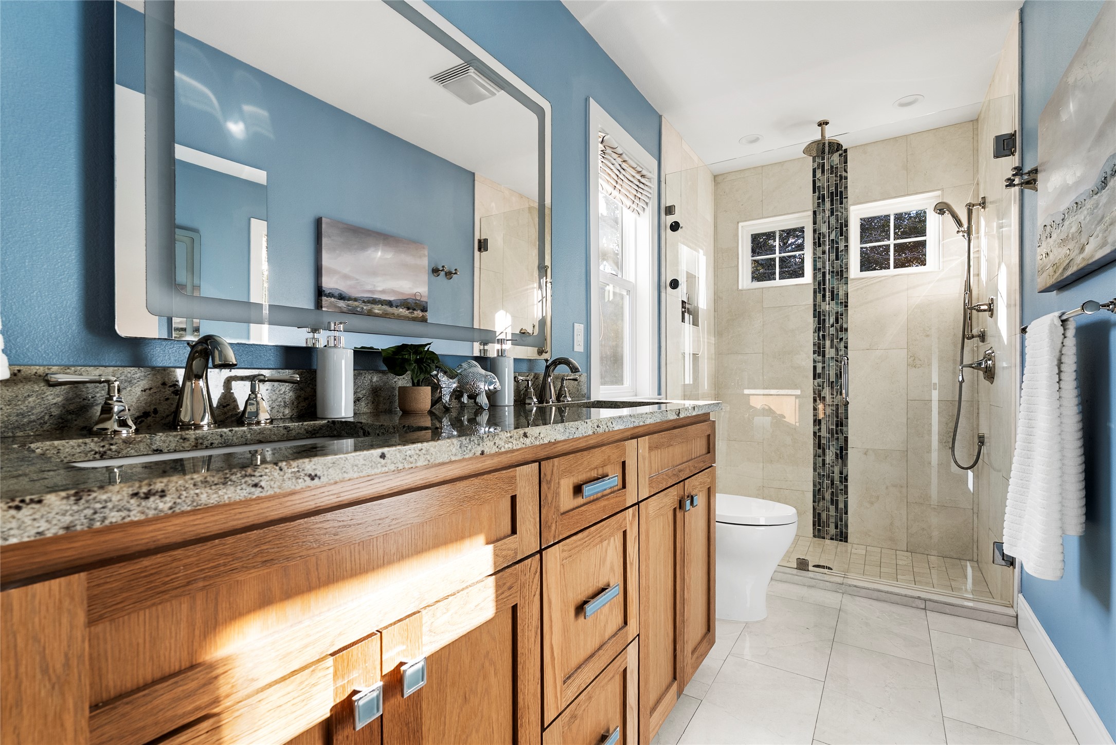 1507 Newning Avenue Austin, TX 78704 - Photo 28 of 37 Bathroom with double vanity, a shower stall, and light tile patterned floors