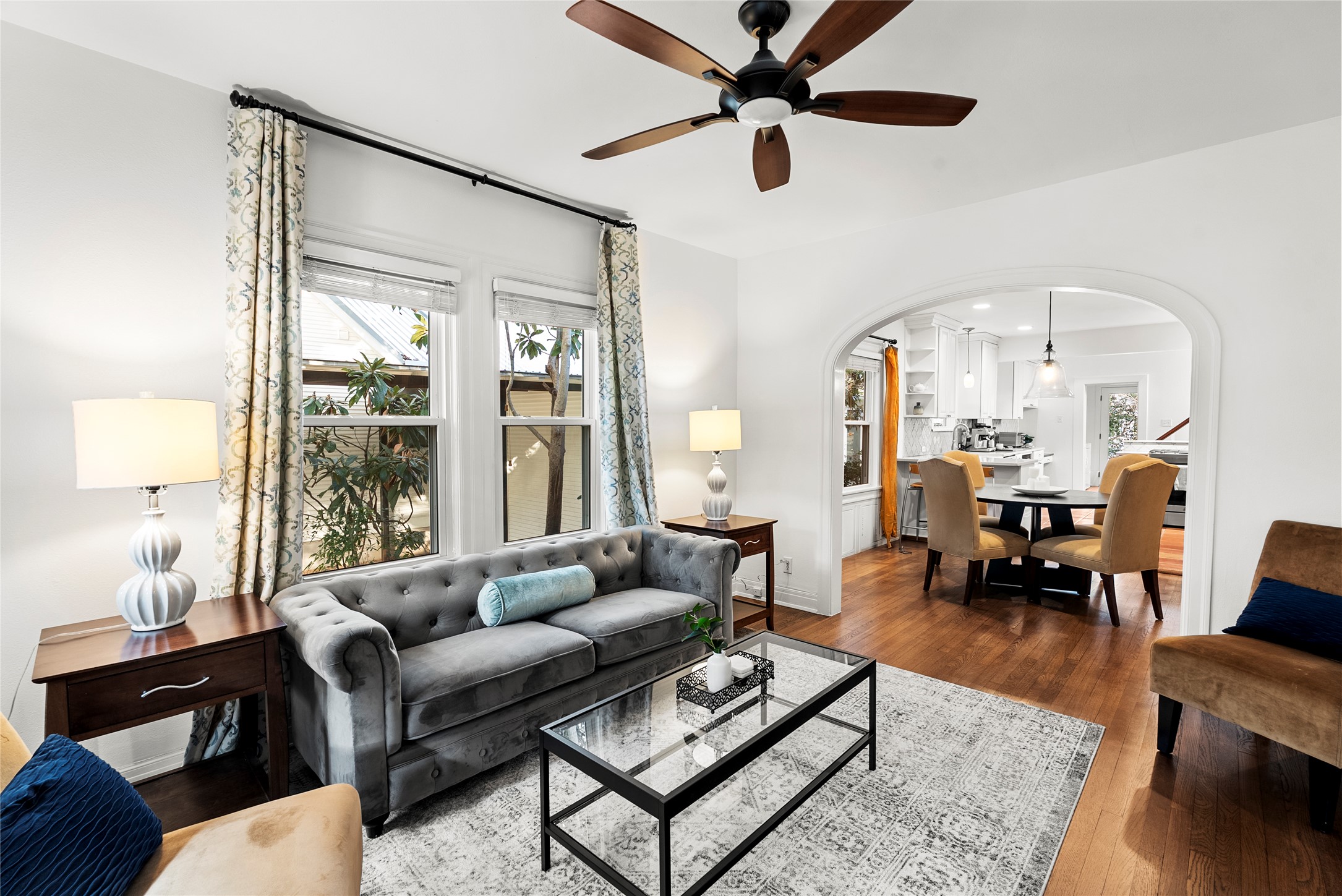 1507 Newning Avenue Austin, TX 78704 - Photo 3 of 37 Living area featuring wood finished floors and arched doorways