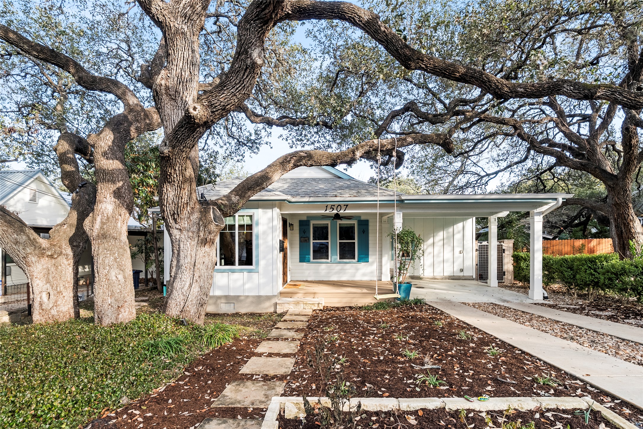 1507 Newning Avenue Austin, TX 78704 - Photo 37 of 37 View of front of property with covered porch and board and batten siding, concrete driveway, and a shingled roof