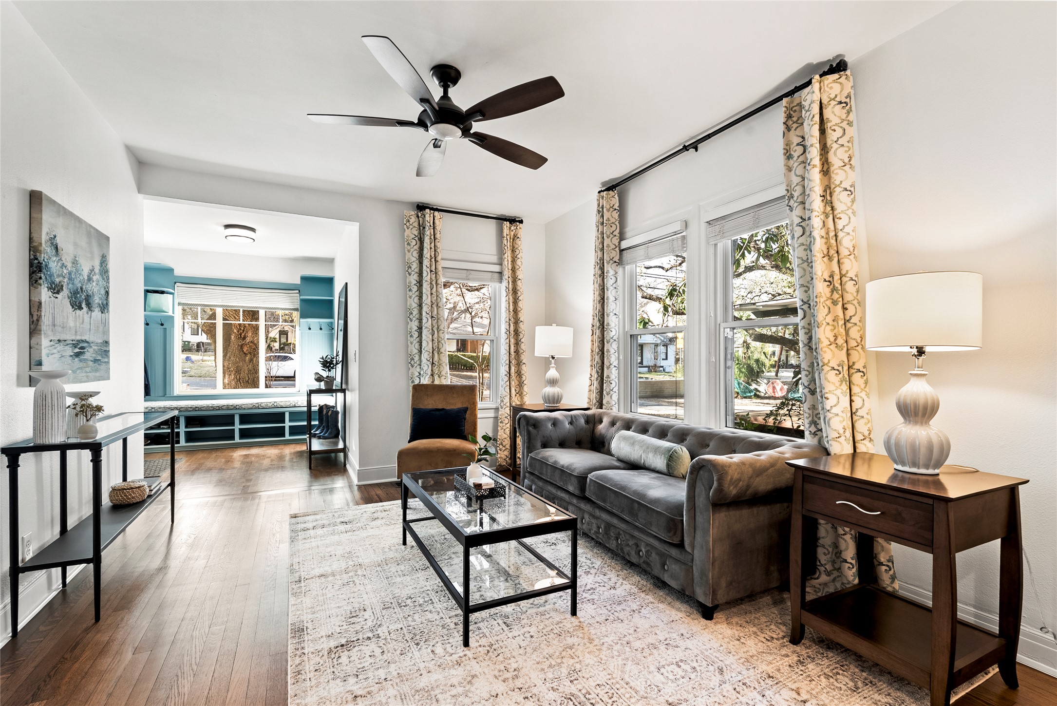1507 Newning Avenue Austin, TX 78704 - Photo 4 of 37 Living room with hardwood floors, a ceiling fan and big windows
