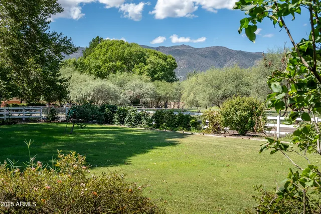 a view of front door and hallway with wooden floor