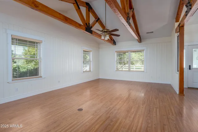 a kitchen with stainless steel appliances granite countertop a sink counter space cabinets and a window