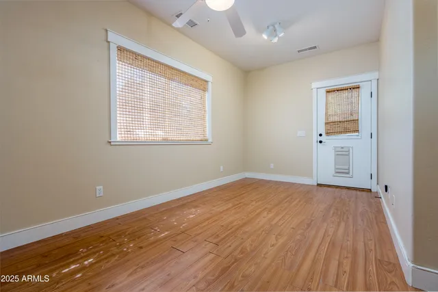 a view of kitchen and wooden floor
