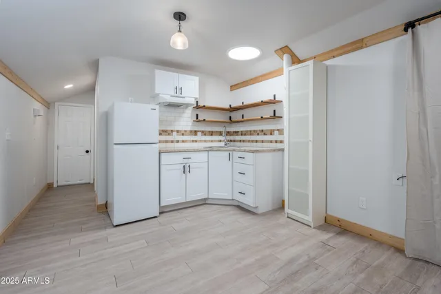 a view of a golf course with a tree