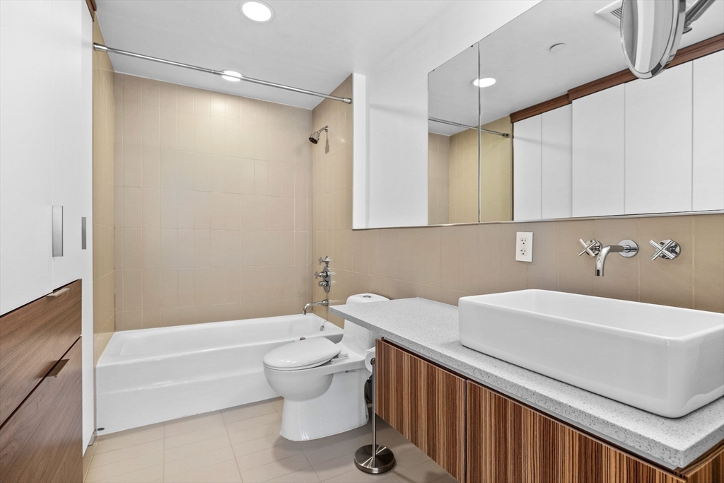 141 Dorchester Avenue, Unit U:616 Boston, MA 02127 - Photo 15 of 23 a bathroom with a sink a toilet and bathtub