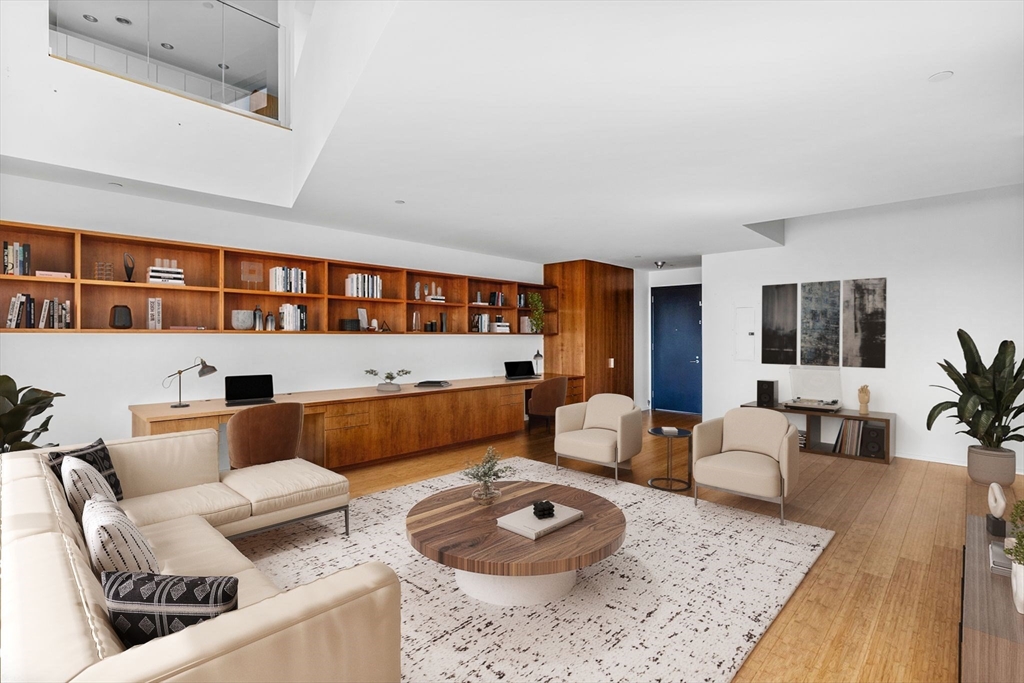 141 Dorchester Avenue, Unit U:616 Boston, MA 02127 - Photo 6 of 23 a living room with furniture and a rug