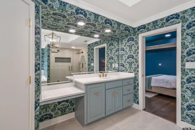 a bathroom with a sink and a mirror