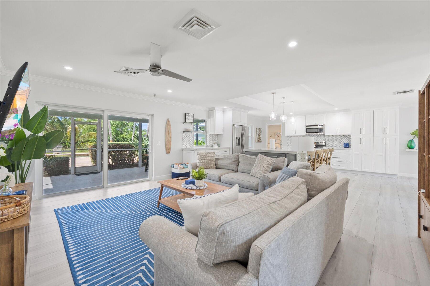5895 Keith Road Jupiter, FL 33458 - Photo 18 of 51 a living room with furniture and a large window
