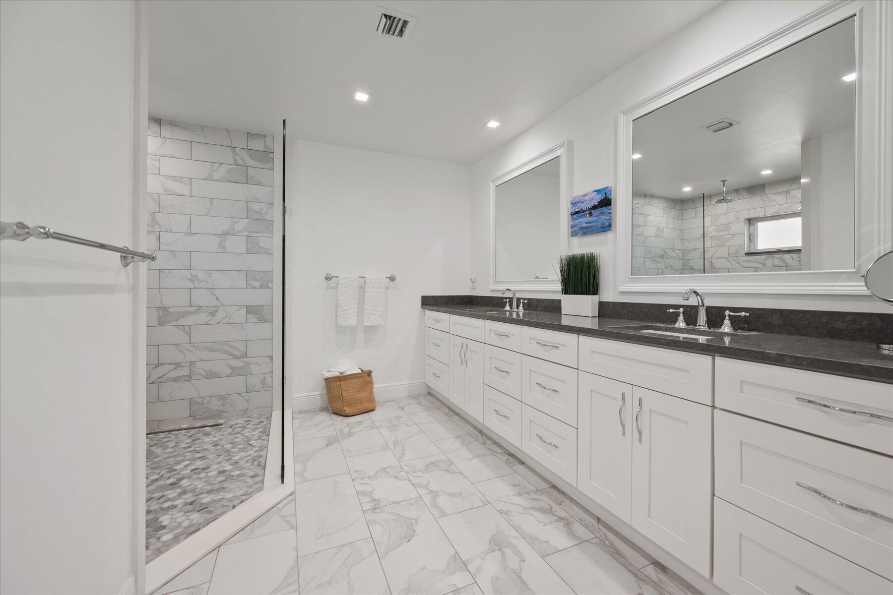 5895 Keith Road Jupiter, FL 33458 - Photo 26 of 51 a bathroom with a sink and a mirror