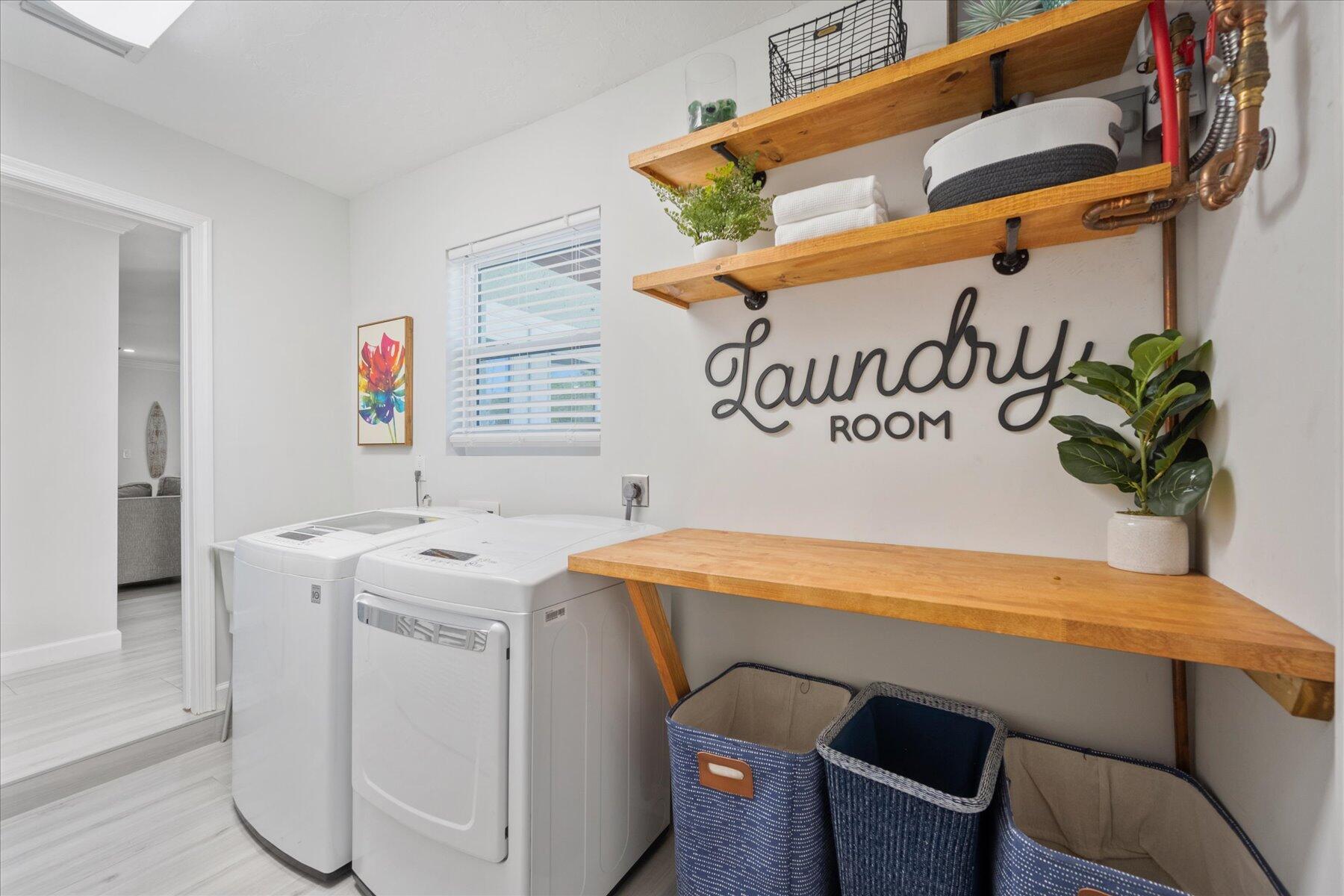 5895 Keith Road Jupiter, FL 33458 - Photo 28 of 51 a utility room with dryer and washer
