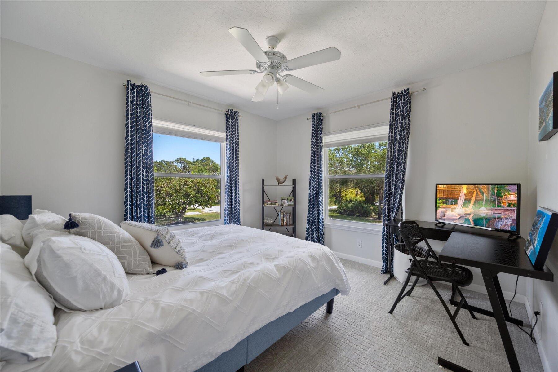 5895 Keith Road Jupiter, FL 33458 - Photo 31 of 51 a bedroom with a bed and a large window