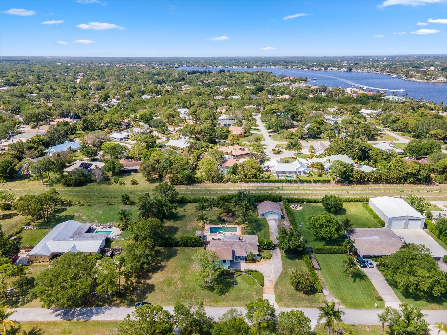 5895 Keith Road Jupiter, FL 33458 - Photo 51 of 51 an aerial view of residential houses with outdoor space