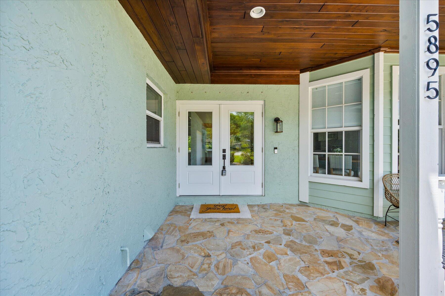 5895 Keith Road Jupiter, FL 33458 - Photo 6 of 51 a view of a entryway door of the house