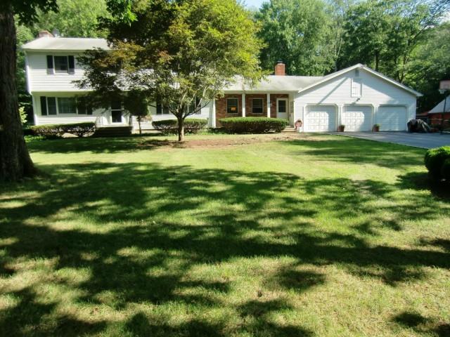 19 Pond Brook Road Newtown, CT 06470 - Photo 1 of 1 a view of house with a big yard and large trees