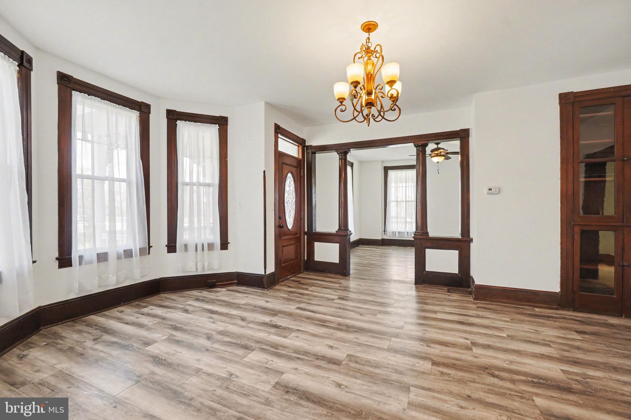 2322 Rock Spring Road Forest Hill, MD 21050 - Photo 12 of 39 a view of an empty room with wooden floor and a window