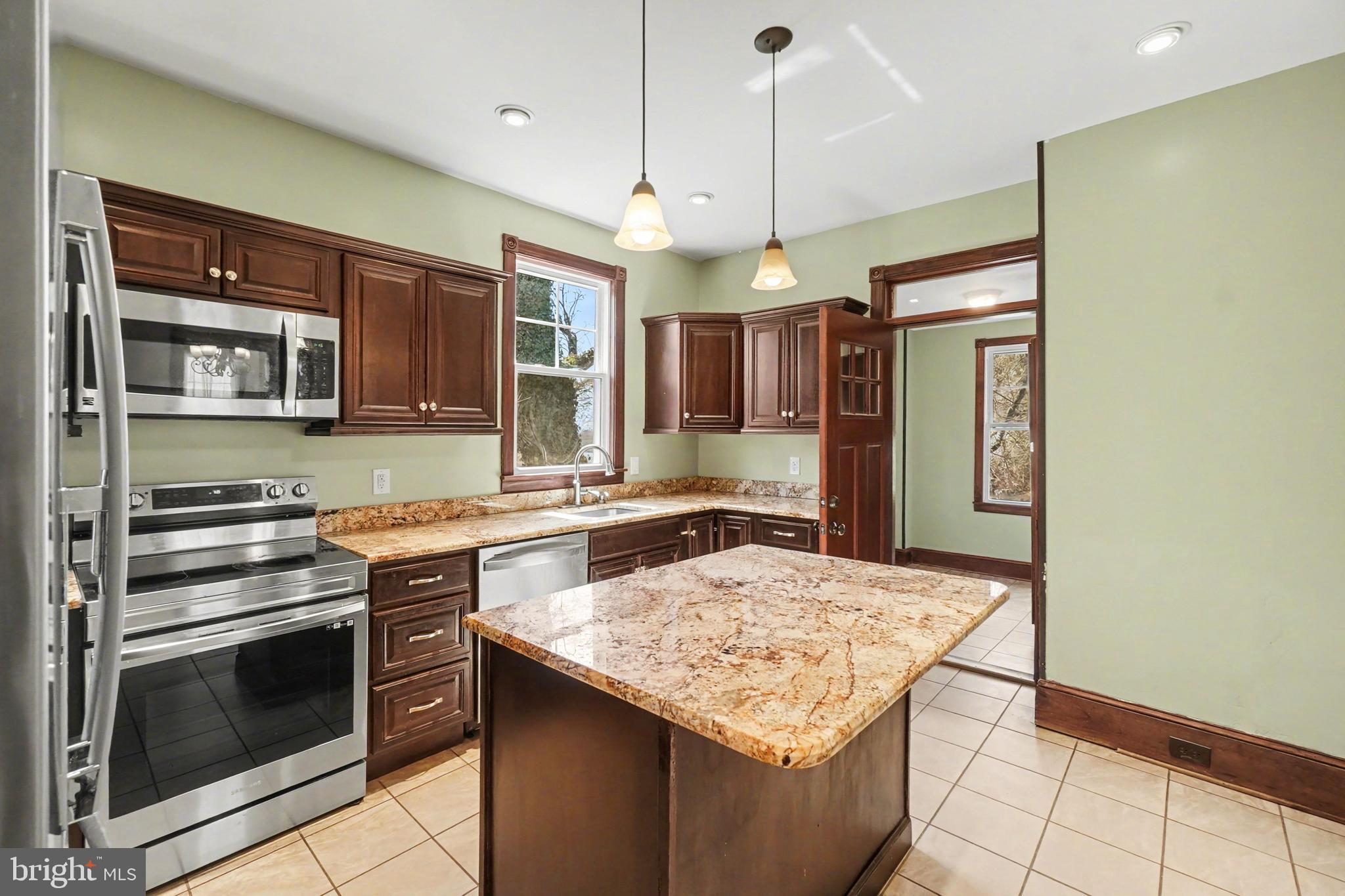 2322 Rock Spring Road Forest Hill, MD 21050 - Photo 16 of 39 a kitchen with a stove and a kitchen island