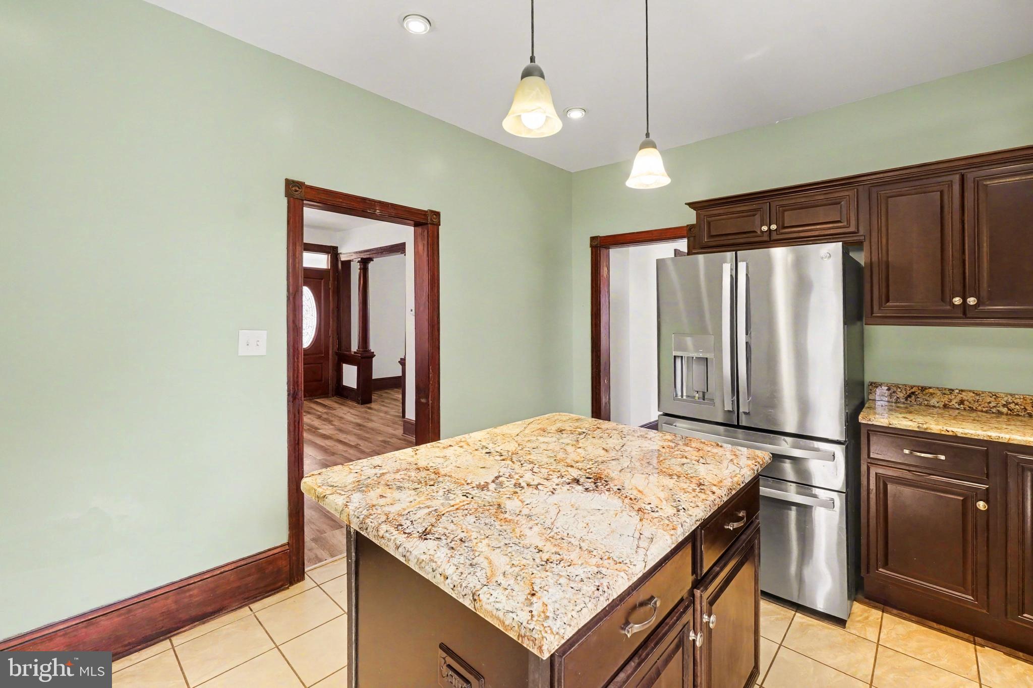 2322 Rock Spring Road Forest Hill, MD 21050 - Photo 17 of 39 a kitchen with granite countertop cabinets and refrigerator