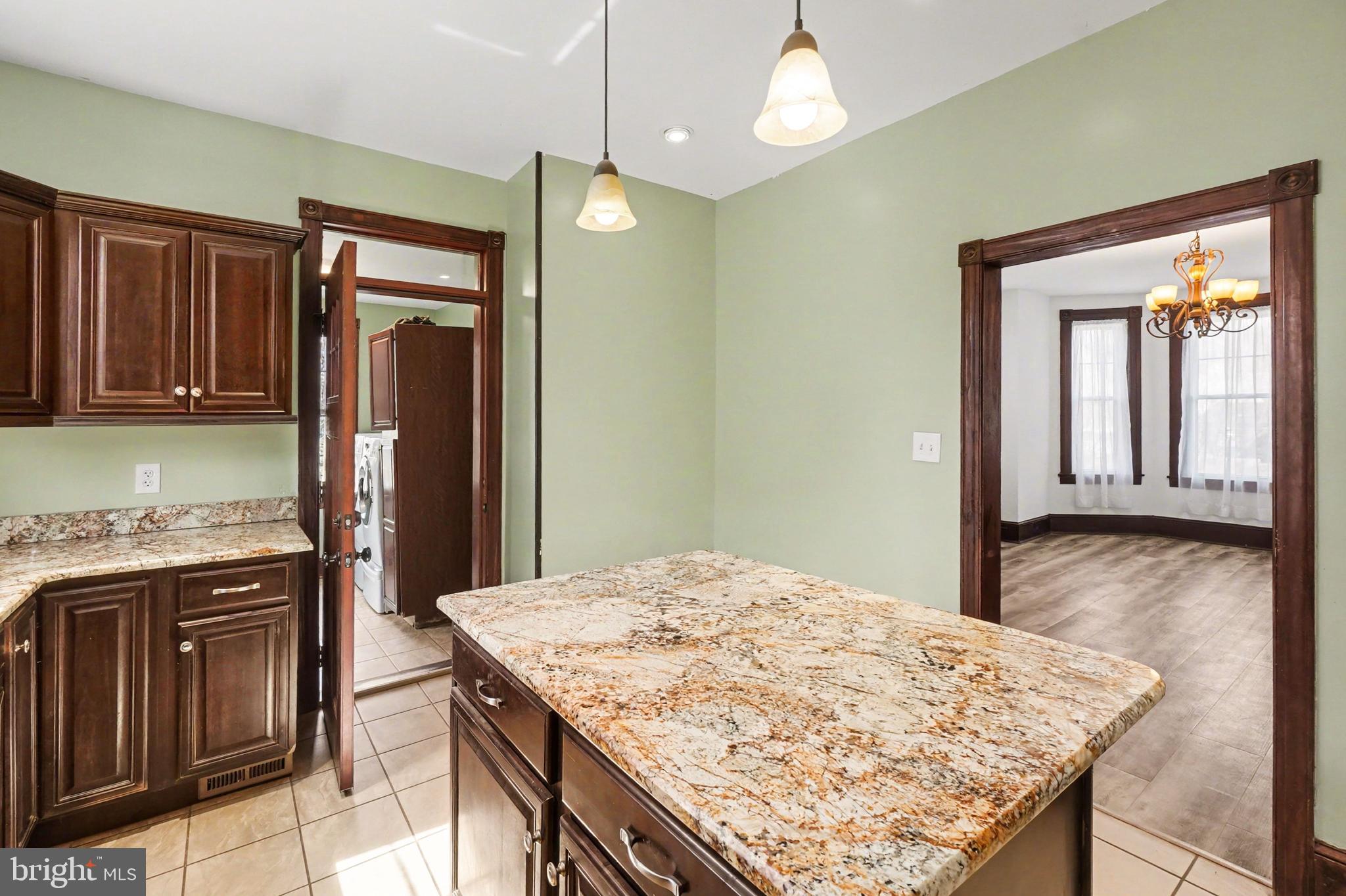 2322 Rock Spring Road Forest Hill, MD 21050 - Photo 19 of 39 a kitchen with stainless steel appliances granite countertop wooden cabinets a refrigerator and a stove