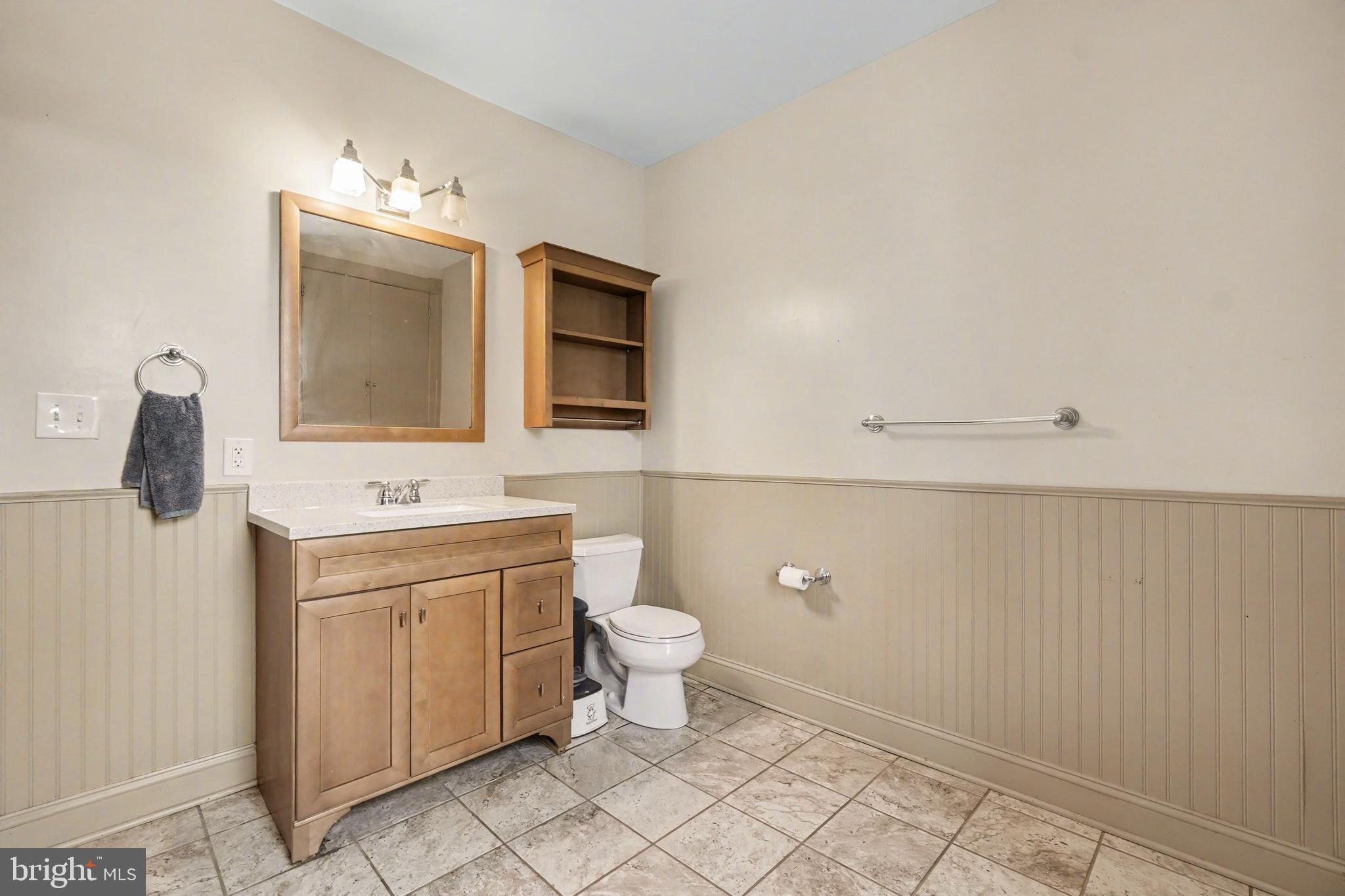 2322 Rock Spring Road Forest Hill, MD 21050 - Photo 21 of 39 a bathroom with a toilet sink and mirror