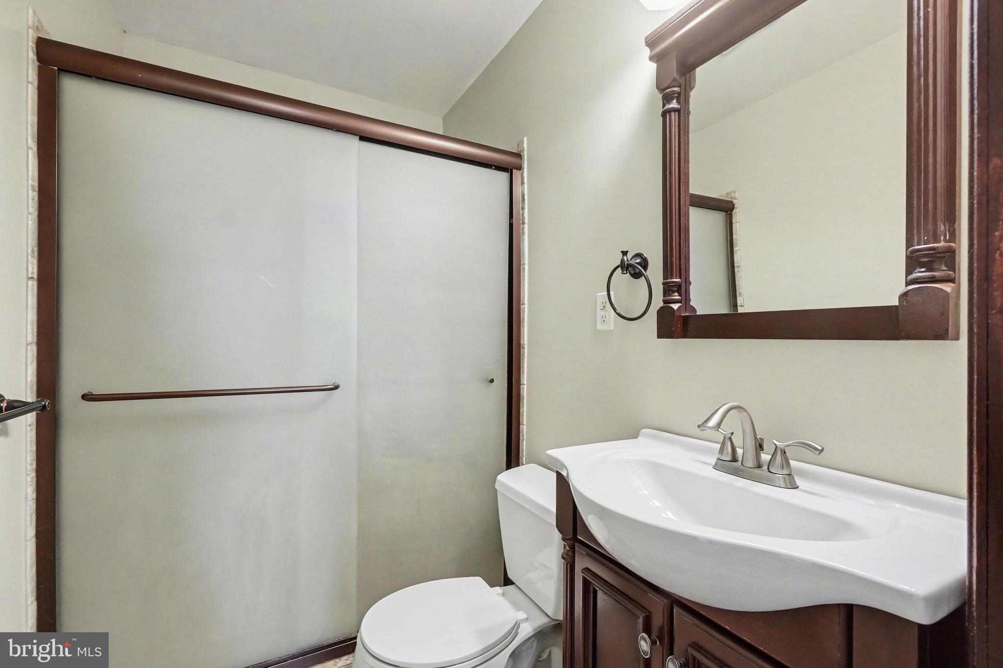 2322 Rock Spring Road Forest Hill, MD 21050 - Photo 27 of 39 a bathroom with a sink toilet and mirror
