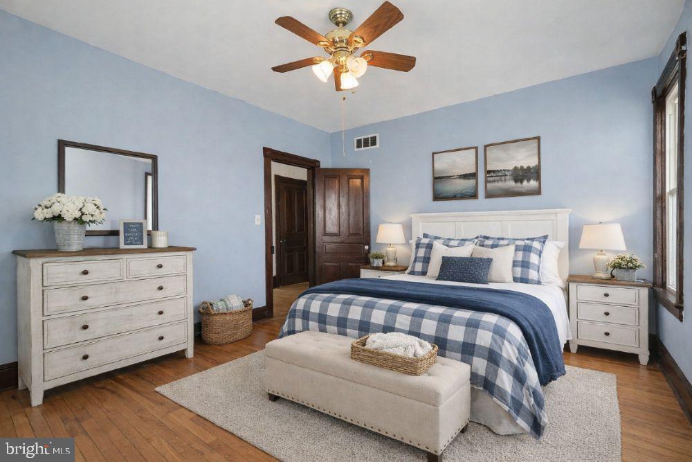 2322 Rock Spring Road Forest Hill, MD 21050 - Photo 28 of 39 a bedroom with a large bed and a chandelier