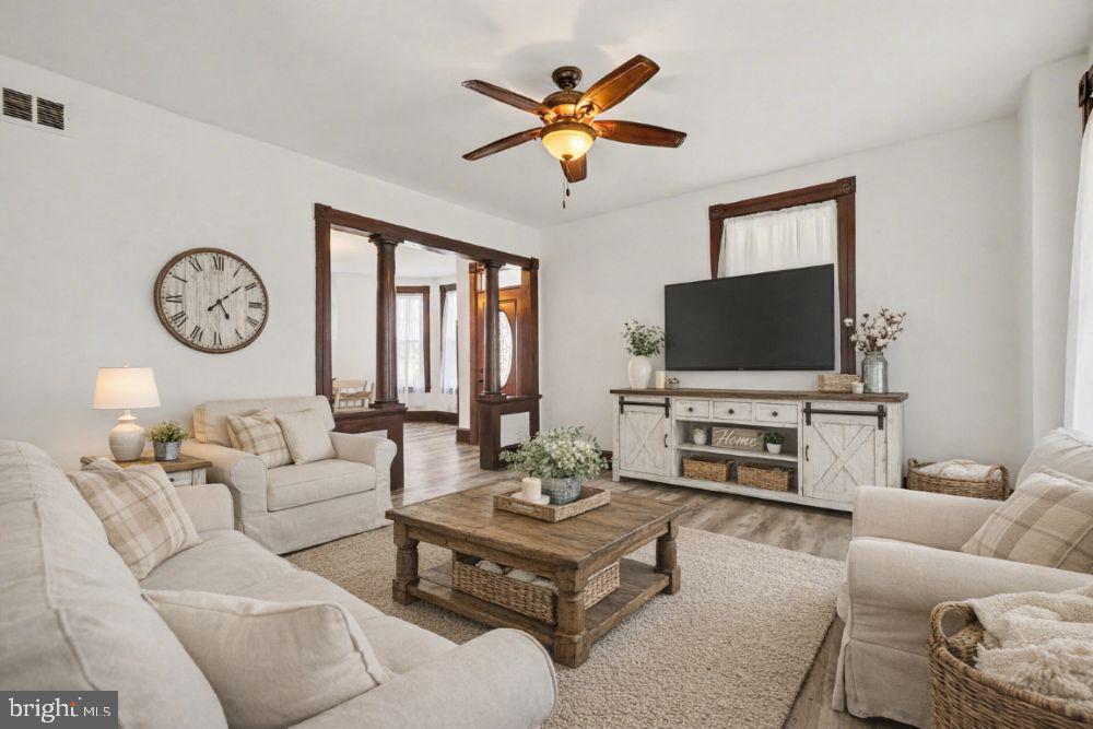 2322 Rock Spring Road Forest Hill, MD 21050 - Photo 6 of 39 a living room with furniture a flat screen tv and a window